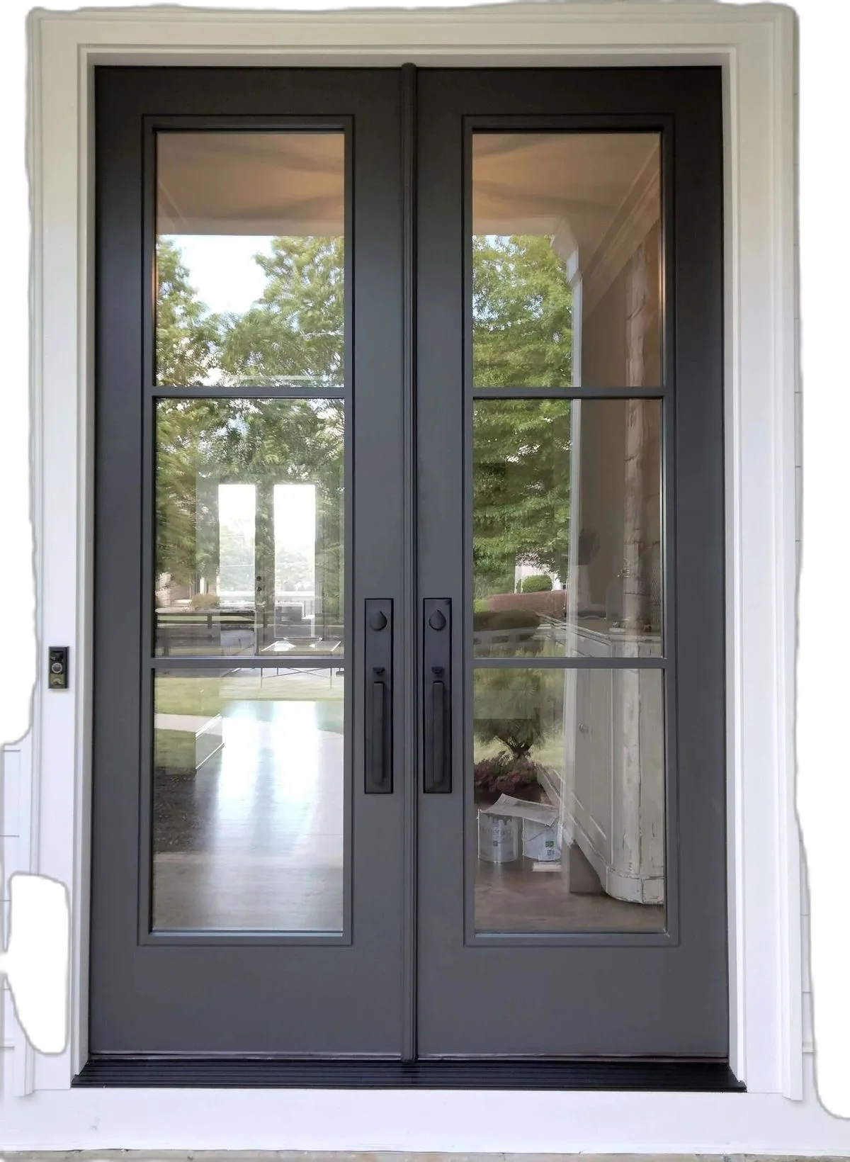 Black steel French front doors with divided glass panels in Austin, Texas