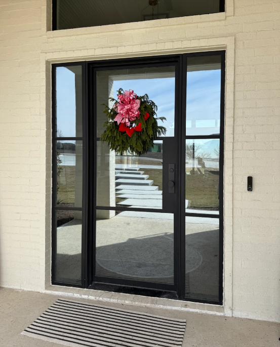 Steel front door with sidelights in Austin TX adding natural light to entryway