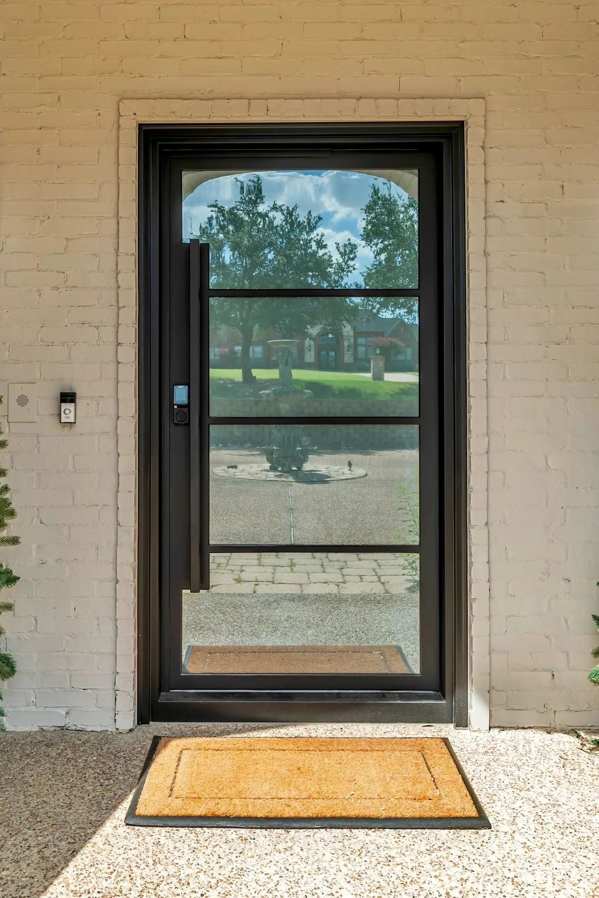 Design inspiration: Arched black steel single front door with four glass panels and smart lock Arched black steel single front door with four glass panels and smart lock