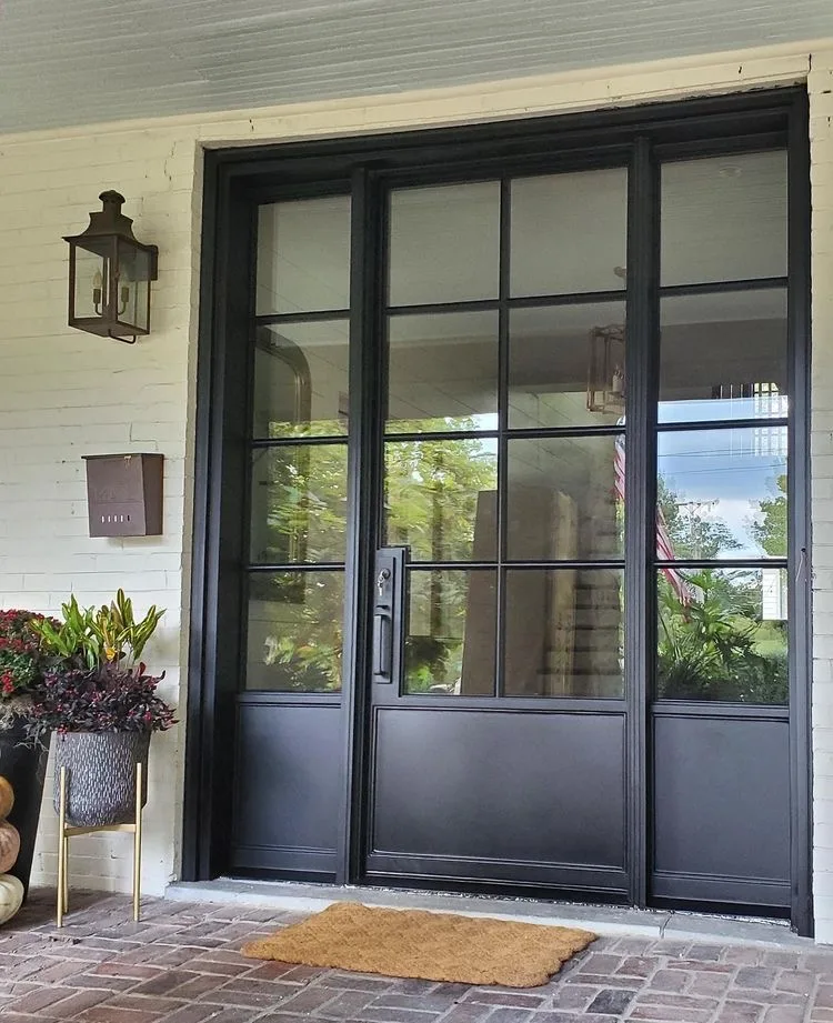 Design inspiration: Custom black steel single front door with glass panels and sidelights for a Texas home Custom black steel single front door with glass panels and sidelights for a Texas home