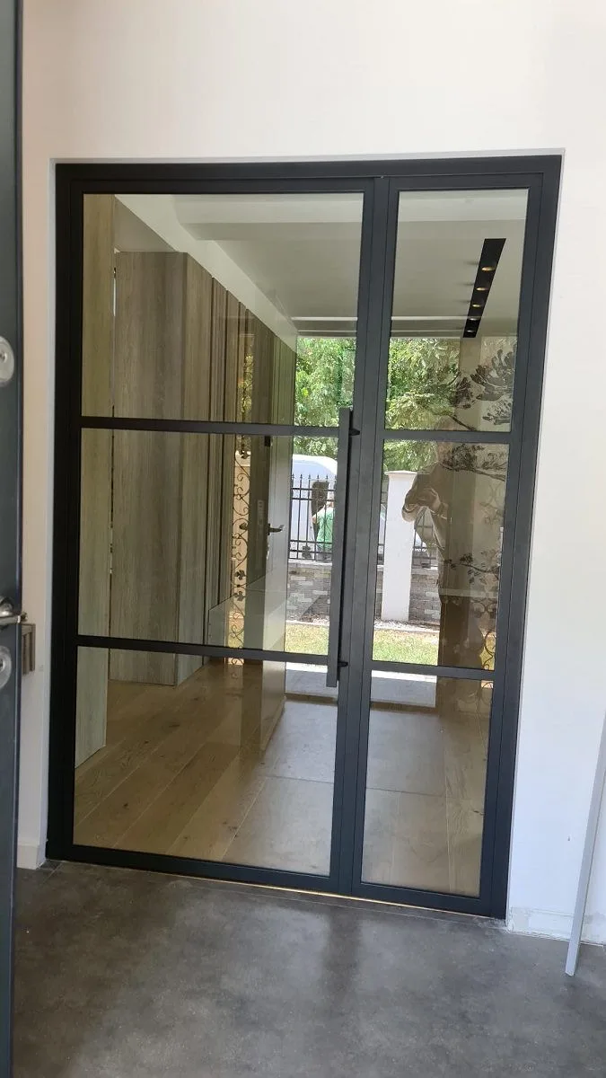 Design inspiration: Interior black steel single door with large glass panes in a modern Austin home Interior black steel single door with large glass panes in a modern Austin home