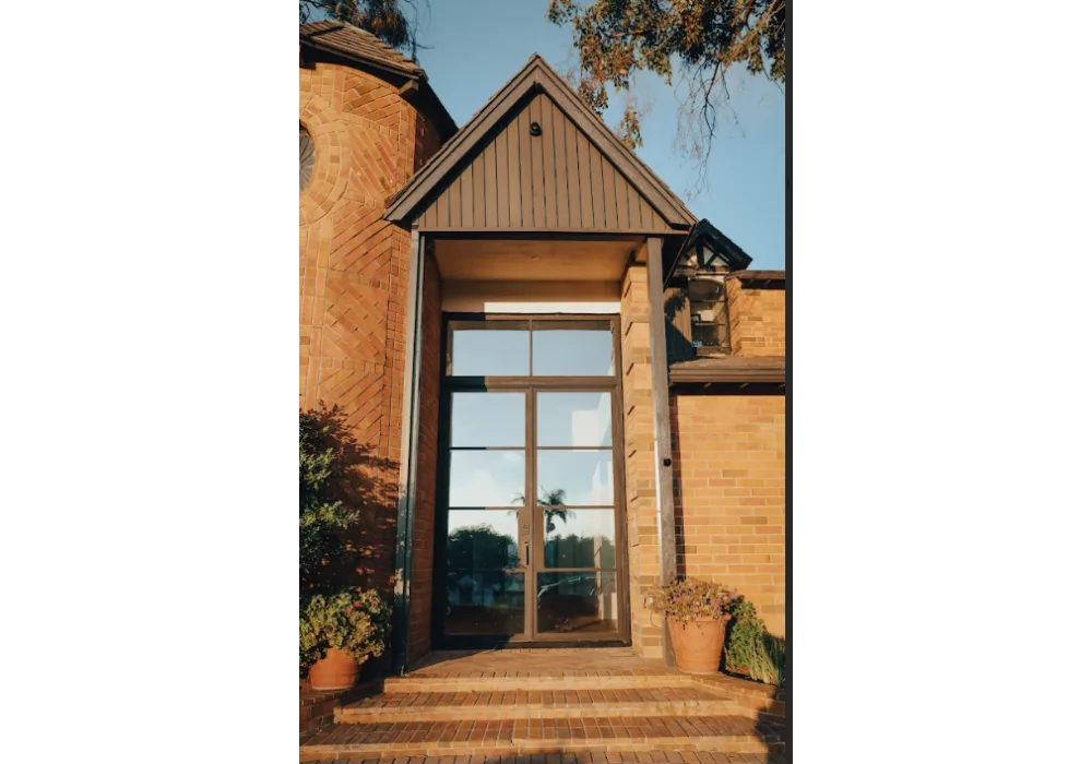 Steel entry door with transom window in Austin TX for taller modern front entrance