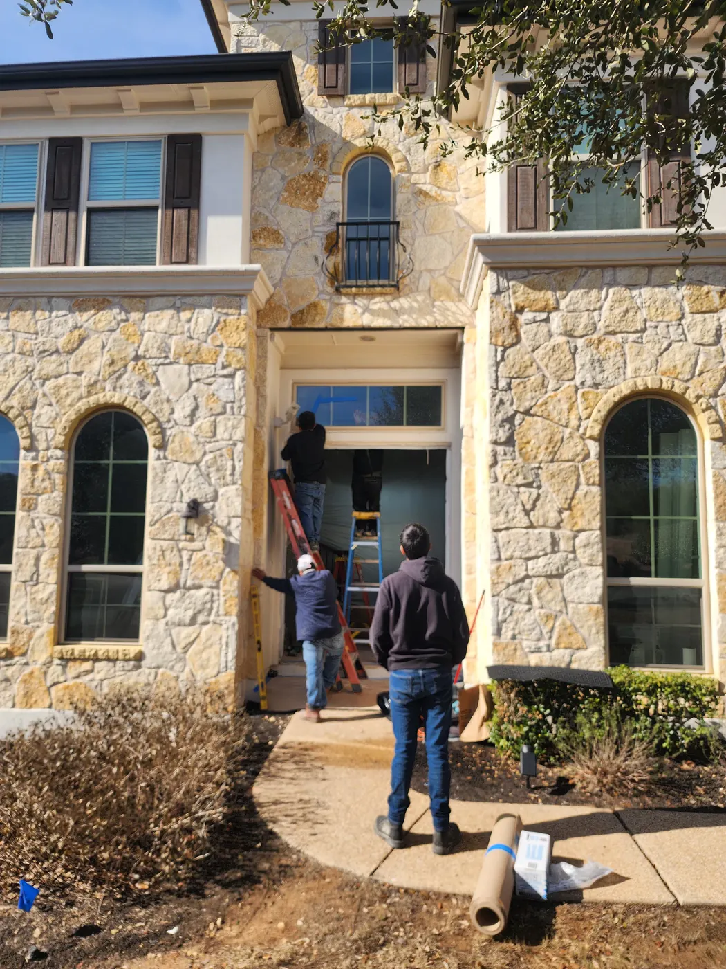 OMG Steel Doors crew removing the old wood entry doors in Dripping Springs
