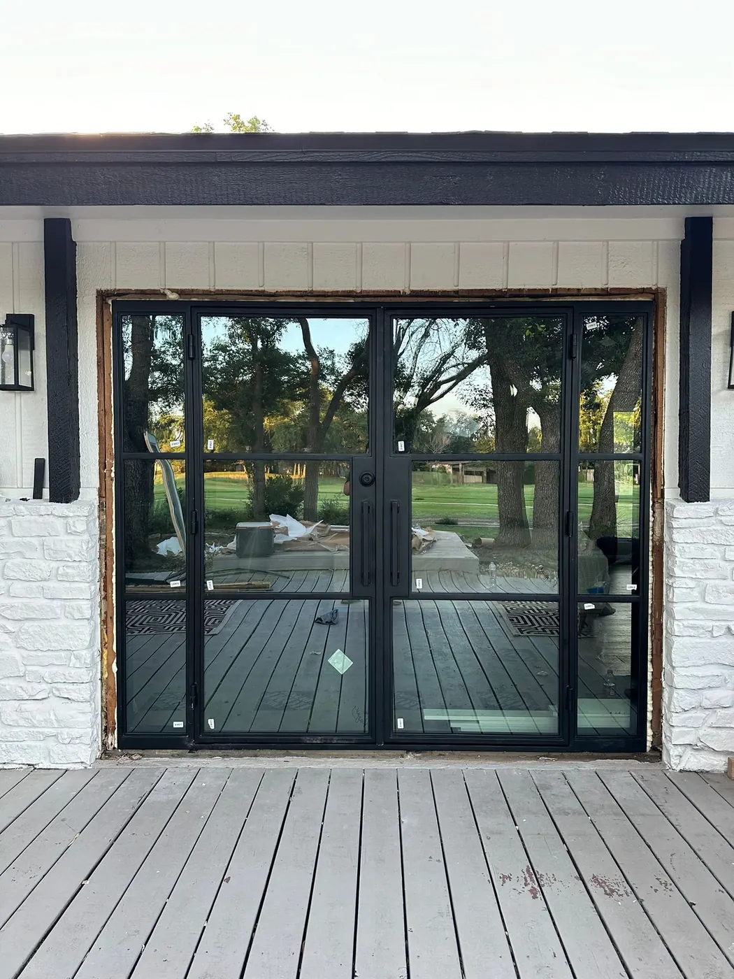 Steel French patio doors installed on the rear elevation of a Lakeway, TX home