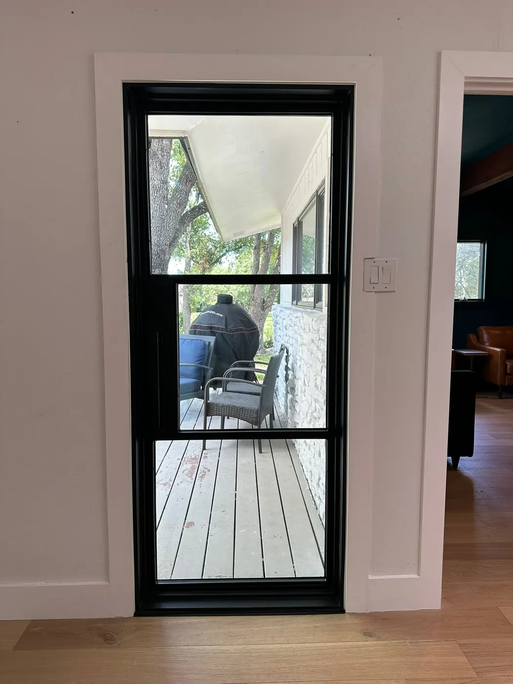 Steel patio doors under a covered porch at a Lakeway, Texas residence