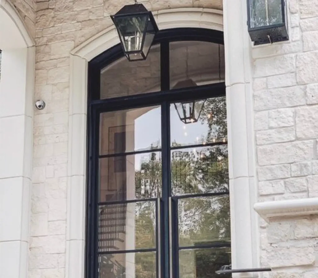 Single steel door opening into a bright contemporary entry