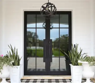 Custom steel and glass wine cellar door in a luxury Bee Cave home