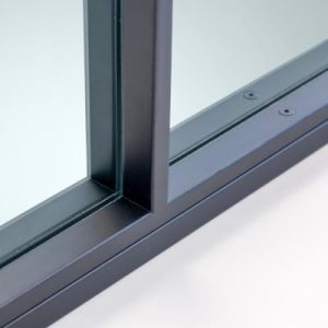 Close-up of a dark steel frame corner with Low-E glass and glazing gasket